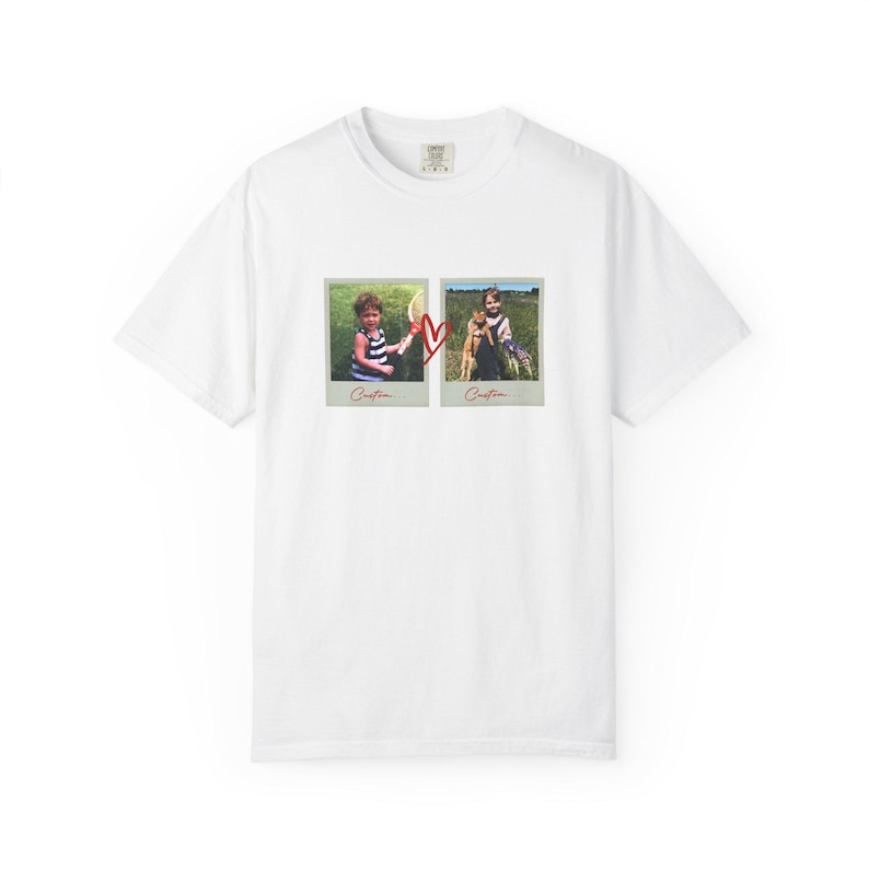 May include: White t-shirt featuring two framed photos with children and a red heart graphic. The photos show children in a field. The word "Cristina" is written below each photo.
