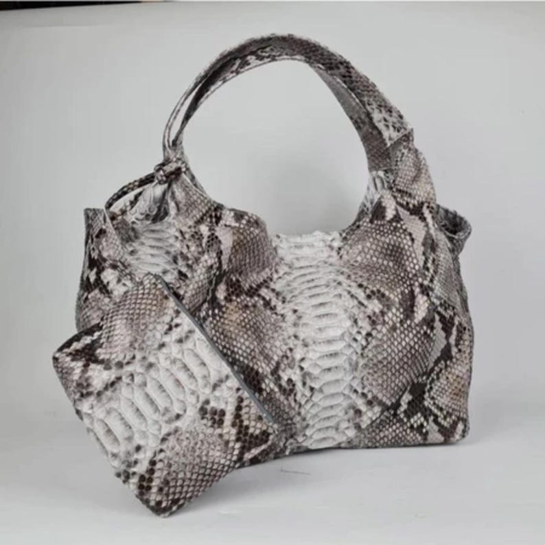 Top view of the Genuine White Python Leather Shoulder Bag with open interior, showcasing its organized, spacious design. Includes a free matching clutch pouch, offering both luxury and practicality in one stylish set.