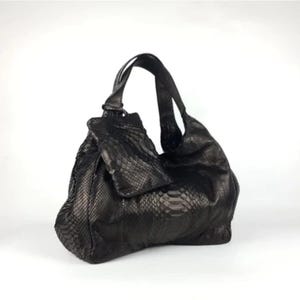 Top view of the Genuine Black Python Leather Shoulder Bag with open interior, showcasing its organized, spacious design. Includes a free matching clutch pouch, offering both luxury and practicality in one stylish set.