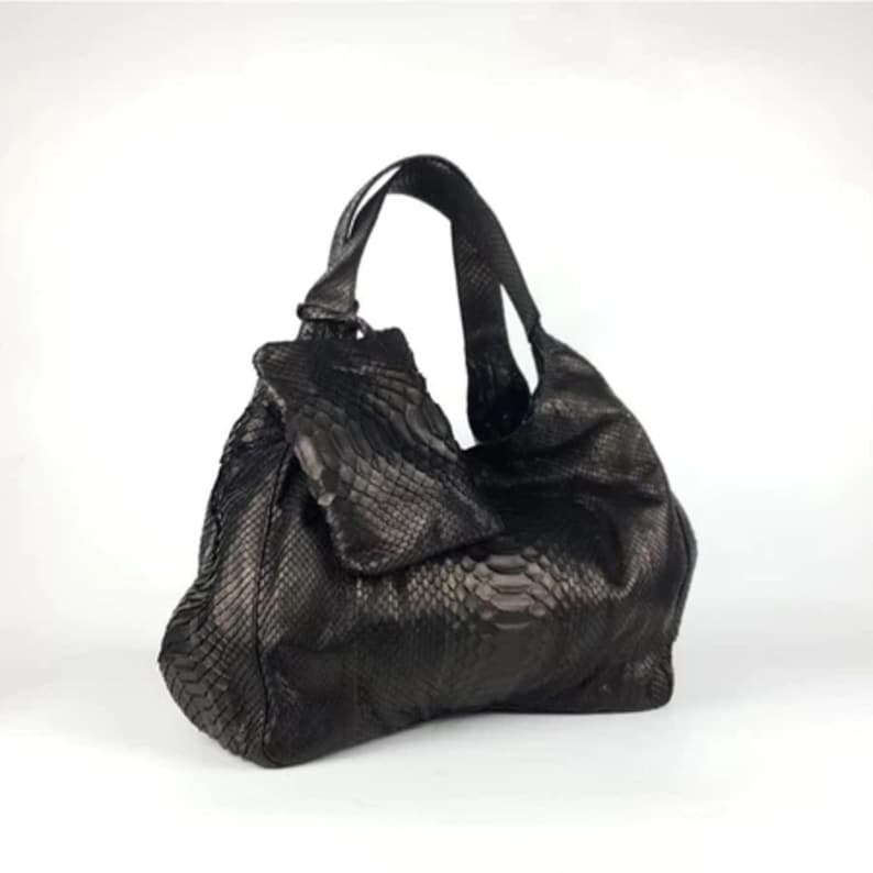 Top view of the Genuine Black Python Leather Shoulder Bag with open interior, showcasing its organized, spacious design. Includes a free matching clutch pouch, offering both luxury and practicality in one stylish set.