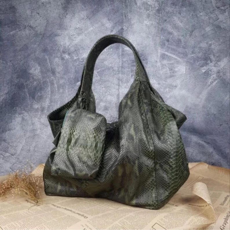 Luxury Genuine Dark Green Python Leather Shoulder Bag with unique natural snake skin patterns and gold hardware, displayed elegantly on a clean white background, showcasing the rare and exotic beauty of real python leather.