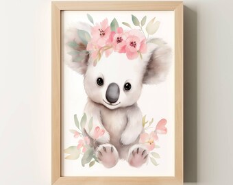 May include: Watercolor illustration of a koala wearing a pink floral crown, surrounded by pink flowers and green leaves. The artwork is framed in a light wood frame. The text "Oakmont Studio" is in the upper left corner.
