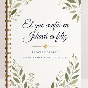 May include: A spiral-bound notebook with a white cover featuring green botanical leaf illustrations in the corners. The text reads: El que confía en Jehová es feliz, PROVERBIOS 16:20, ASAMBLEA DE CIRCUITO 2026-2027, with a small gold leaf icon.