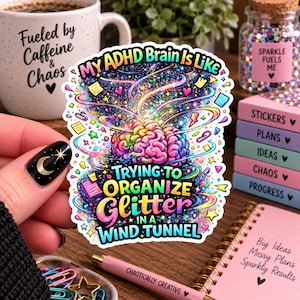 May include: A die-cut sticker featuring a colorful, swirling brain illustration surrounded by cosmic patterns, stars, and small icons. The text reads: MY ADHD BRAIN IS LIKE TRYING TO ORGANIZE GLITTER IN A WIND TUNNEL, rendered in vibrant, multi-colored lettering.