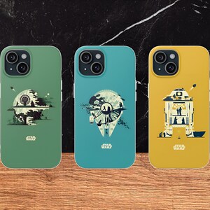 May include: Three Star Wars themed iPhone cases. The first case is green with a silhouette of the Death Star. The second case is blue with a silhouette of the Millennium Falcon. The third case is yellow with a silhouette of R2-D2.