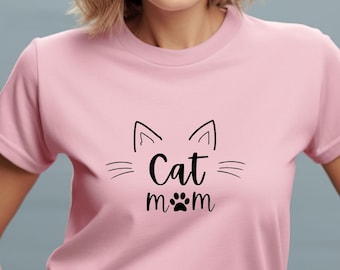 May include: A pink t-shirt with a black cat graphic and the text "Cat mom" with a paw print.