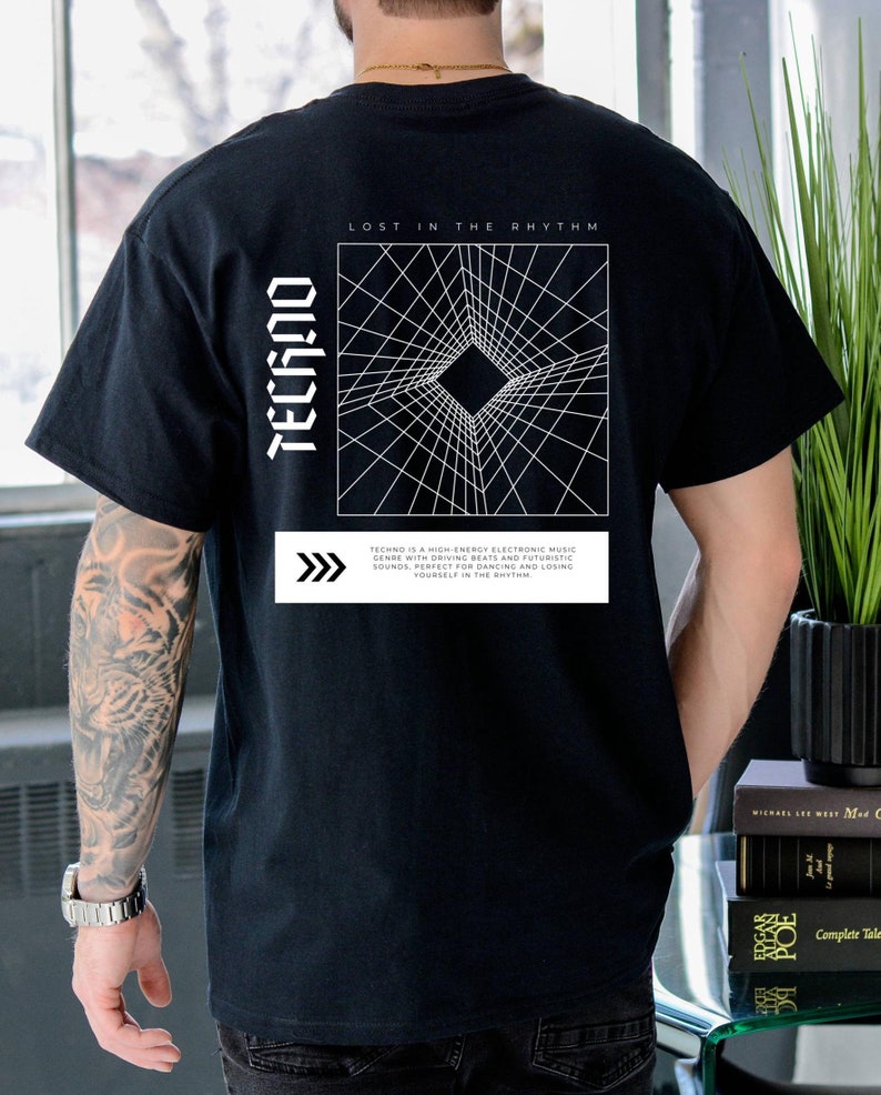 May include: Black t-shirt with the word "TECHNO" in white, vertical text on the left side. The back features a white geometric design and the text "LOST IN THE RHYTHM". Below the design is a description of the music genre.