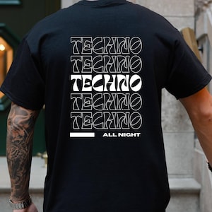 May include: Black t-shirt with a white graphic design that says "Techno" repeated five times and "All Night" at the bottom.