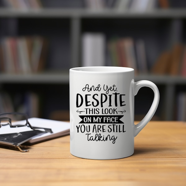 Despite the look on my face you are still talking, Sarcastic Funny Coffee Mug, work sucks, funny work or office phrase or saying