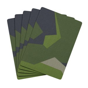 May include: A stack of six playing cards with a camouflage pattern in shades of green and gray.