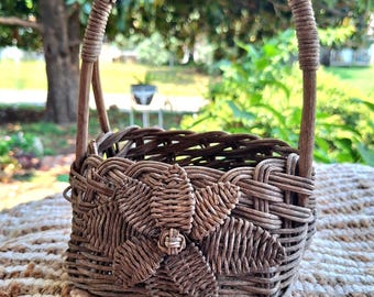 Vintage Wicker Basket with Woven Flower: Weathered Catchall Decor