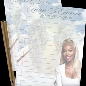 May include: Two sheets of lined paper with the text "Letters To Heaven Unspoken Words" and a gold pen. The paper has a sky and cloud background with angel wings. A woman with blonde hair is in the background.