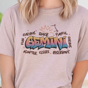 a woman wearing a t - shirt with the word genni on it