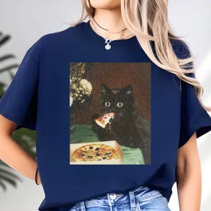 A black cat is eating a pizza from a box, as depicted in the image.