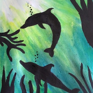 May include: An abstract painting depicting two black dolphins in an underwater scene. The background is a mix of green and blue, with light rays. Silhouetted seaweed and bubbles create depth. The artwork evokes a sense of the ocean.