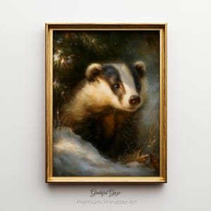 May include: A framed painting of a badger in a snowy forest setting. The badger has a black and white face and brown fur. The painting is in a gold frame and has the text "Grateful Gaze Premium Printable Art" at the bottom.