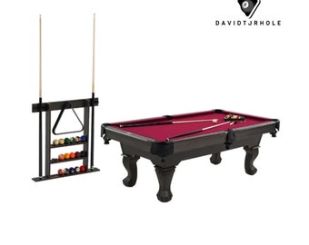 A pool table complete with accessories for playing