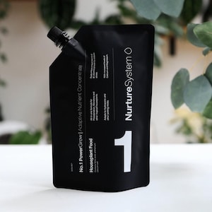 May include: Black pouch with a white label that says "No.1 PowerGrow | Adaptive Nutrient Concentrate" and "Houseplant Food". The pouch also has a white label with the text "Nurture System" and the number "1" in a large white font.