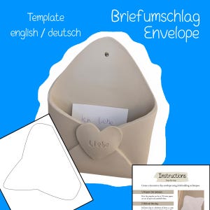 May include: A beige ceramic envelope-shaped wall pocket with a heart detail and the word "Liebe". The pocket holds a note that says "Ich liebe". The image includes the words "Template english / deutsch" and "Briefumschlag Envelope".