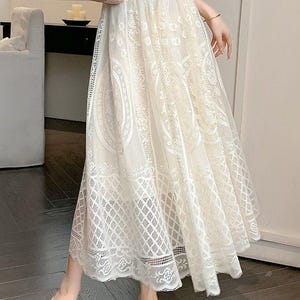 Ivory Lace Maxi Skirt. This beautiful lace and tulle maxi skirt is a must-have for your wardrobe!