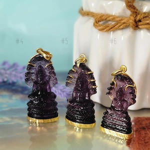 May include: Three purple amethyst Buddha pendants with gold accents. The pendants are numbered #4, #5, and #6.