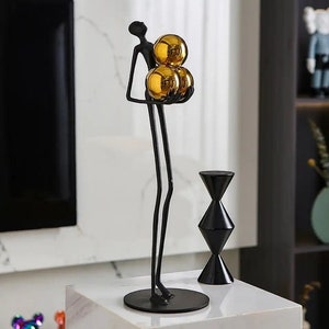 Modern black & gold abstract statue, Resin sculpture, Elegant stick figure holding gold balls ornament, Home decor statue, Birthday gift