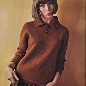 May include: A brown knitted sweater with a collared neckline and button closure. The sweater has long sleeves and a relaxed fit.