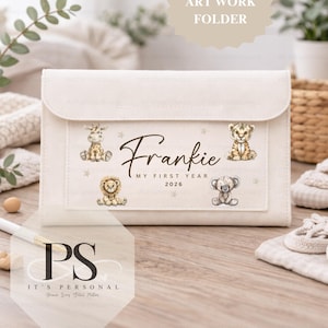 May include: Cream-coloured artwork folder with a flap closure. The folder is personalised with the name "Frankie", the text "MY FIRST YEAR 2026", and illustrations of a giraffe, lion, tiger, and koala bear.