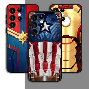 May include: Three phone cases featuring superhero characters. The first case is blue and red with a gold star and a character from Captain Marvel. The second case is red, white, and blue with a character from Captain America. The third case is gold and red with a character from Iron Man.