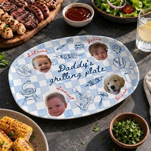 May include: An oval, blue and white checkered plate with the words "Daddy's grilling plate" in the center. The plate has illustrations of grilling tools and food, and photos of children and a dog. The plate is surrounded by food.
