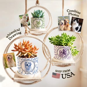 May include: Three hanging circular wooden frames with white distressed finish, each holding a ceramic planter with a saucer. The planters feature custom pet portraits and names, containing green and orange succulents. Text includes "whimsical Drawing", "Combine Photos", and "SHIP FROM USA".
