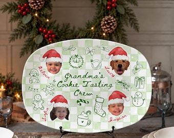 May include: An oval ceramic serving platter with a light green and white checkered pattern. It features the text "Grandma's Cookie Tasting Crew" in green, surrounded by green line-art holiday icons and four photos of children and a dog wearing Santa hats.