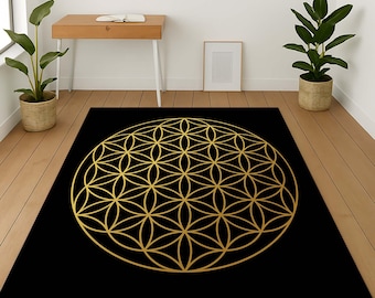 May include: A black and gold area rug with a geometric pattern of a flower of life design.
