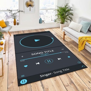 May include: A black and blue rug with a music player design. The rug features a play button, a song title, a singer's name, and a progress bar. The rug also has a heart, rewind, pause, fast forward, star, and download buttons.