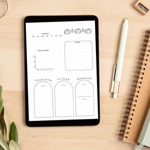 May include: A black and white digital planner with a pumpkin theme. The planner includes sections for weather, mood tracker, notes, and daily tasks. The days of the week are labelled: Monday, Tuesday, Wednesday, Thursday, Friday, Saturday, and Sunday. The planner also includes a section for weekend tasks.