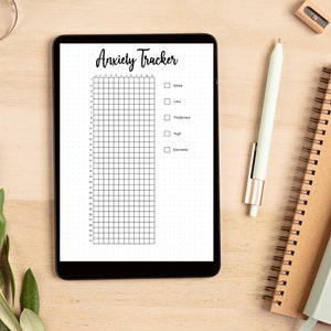 May include: A digital anxiety tracker on a tablet screen. The tracker has a grid with numbers 1-31 and the months of the year. There are checkboxes for rating anxiety levels: None, Low, Moderate, High, and Extreme.