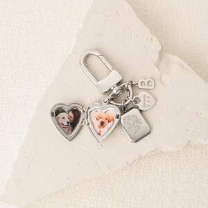 a couple of key chains with pictures on them