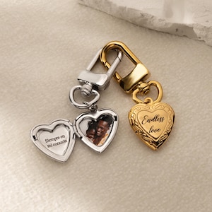 a couple of heart shaped key chains sitting on top of a table