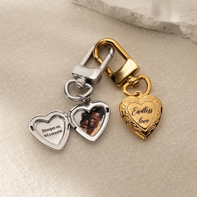a couple of heart shaped key chains sitting on top of a table