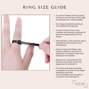 a person holding a ring size guide in their hand