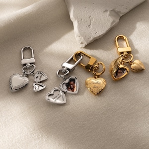 a couple of charms sitting on top of a table