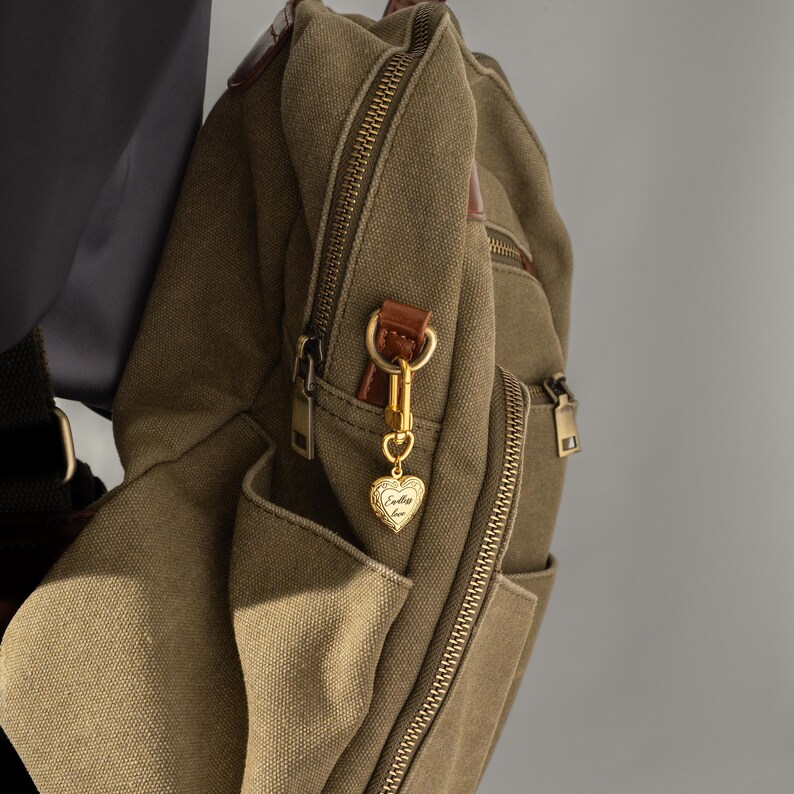 a backpack with a gold key hanging from it