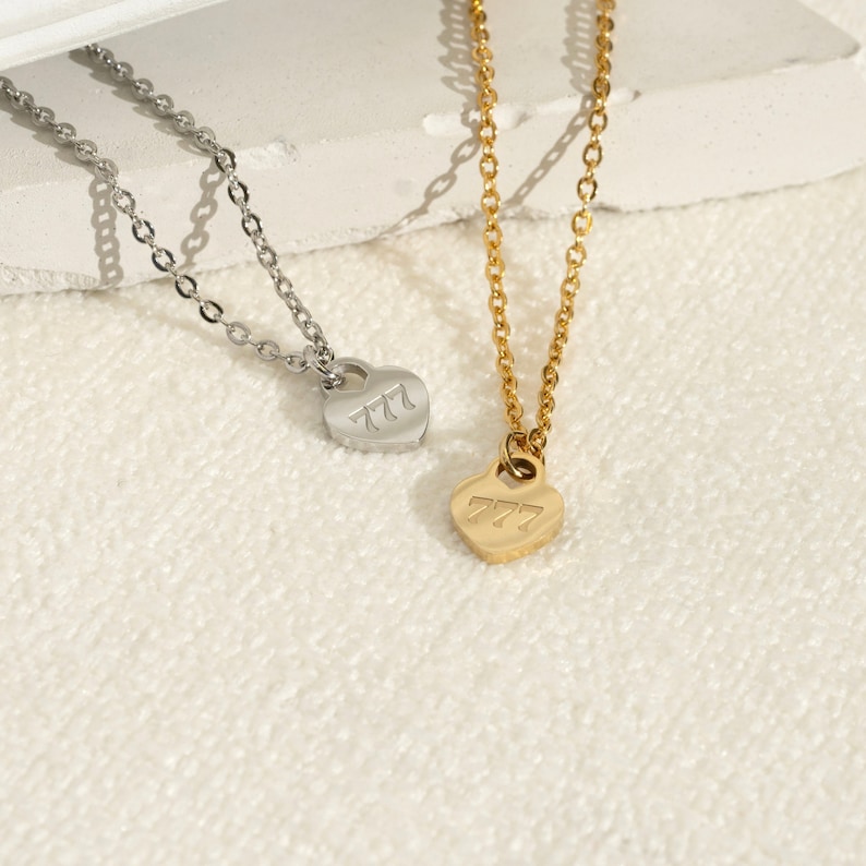 a couple of necklaces sitting on top of a table