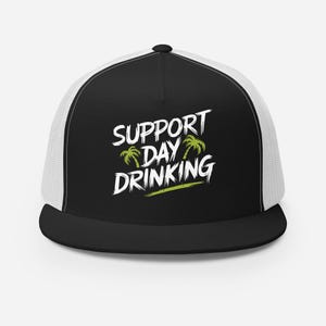 May include: Black and white trucker hat with a white mesh back. The front of the hat features a graphic with the text "SUPPORT DAY DRINKING" and two green palm trees.