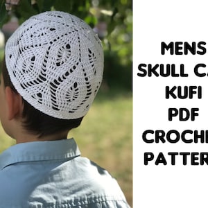 May include: A white, crocheted skull cap with an openwork design. The cap is worn by a person in a light blue shirt. Text on the right side of the image reads: MENS SKULL CAP KUFI PDF CROCHET PATTERN.