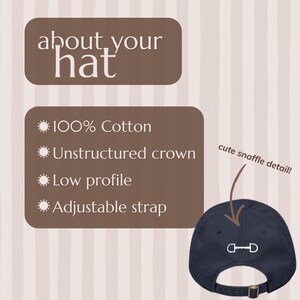 May include: Navy blue baseball cap with a white snaffle bit design. Features include 100% cotton, unstructured crown, low profile, and an adjustable strap. The text says "about your hat".