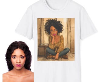 May include: White t-shirt featuring a colorful illustration of a woman with curly hair, wearing a mustard-colored top and blue jeans, sitting on a wooden floor. The artwork has a warm, inviting color palette.