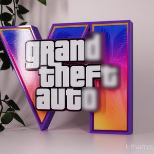 May include: A colorful, stylized sign featuring the words "grand theft auto" in a bold, white font. The sign has a V-shaped element with a pink and purple gradient, and a rectangular element with a similar gradient. The edges are outlined in purple.