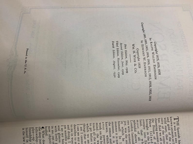 May include: Open book page with text including copyright information for a book by Ralph Waldo Emerson and Edward W. Emerson. The text includes the publisher, edition dates, and "Printed in the U.S.A."