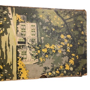 May include: Vintage box with a colorful illustration of a house and surrounding trees. The artwork features a house with multiple windows, surrounded by green foliage and yellow flowers. The text "HOME OF EMERSON, CONCORD, M" is visible on the side.